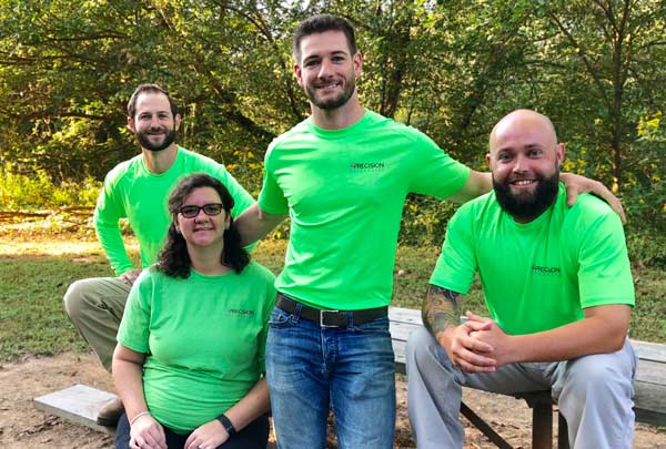 Members Of The GreenWorks EcoScape Team Sitting Around A Picnic Table At The Park