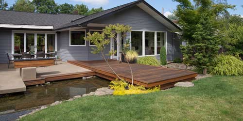 Home With Water Feature And Custom Designed Landscaping